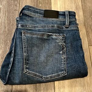 Buckle Black jeans. Tailored bootcut. Medium wash.